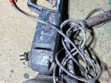 an old power cord and a cord cutter on the floor
