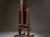 a wooden easel with a bunch of sticks on top of it