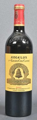 bottle of red wine with a bell on the top of it