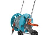a hose cart with a hose attached to it on a white background