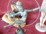 a statue of a woman with a hoop around her neck