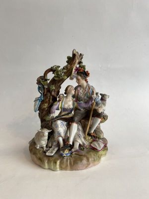 an image of a figurine of a group of people sitting on a bench