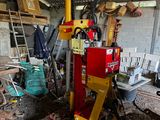 a small machine that is sitting in a garage