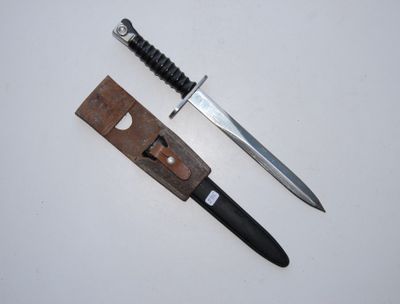a knife that is laying next to a knife holder
