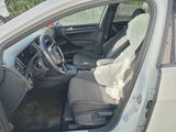 the interior of a car with a cloth draped over the front seat