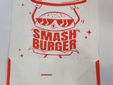 a bag with a sandwich on it that says smash burger