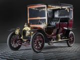 a very old car that is sitting on a checkered floor