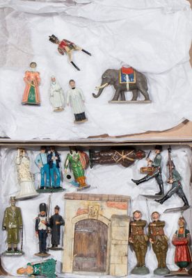 many figurines in the box on the table