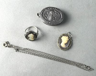 three pieces of jewelry including a necklace, ring, and bracelet