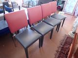several chairs are lined up in a row in a living room