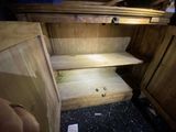 a wooden cabinet with two shelves in the corner