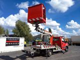 a red truck with a crane on the back of it