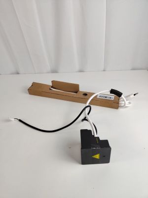 a small black box with a white cord attached to it