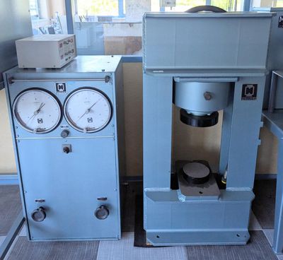 two machines that are sitting next to each other in a room