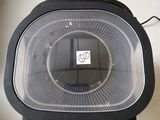 a black fan sitting on top of a white counter