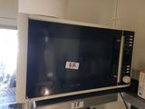 a microwave sitting on top of a counter in a kitchen