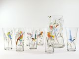 seven glasses and a pitcher with birds painted on them