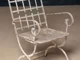 a metal chair that is sitting on the floor