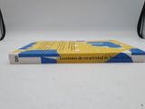 a yellow and blue book sitting on a white table