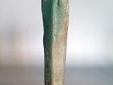 an egyptian statue of a woman with a green body on a black base