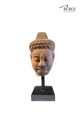 an image of a statue of a head with a hat on it