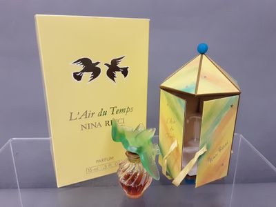 a box with a perfume in it and a box with a perfume in it