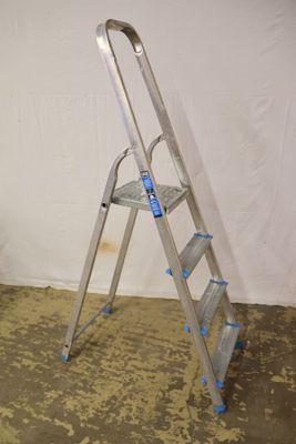 a ladder that is leaning against a wall in a room