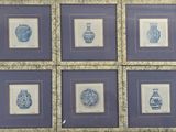 six framed blue and white vases on the wall