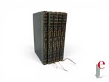 three books are stacked on top of each other on a white surface