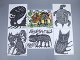 four cards with drawings of animals and birds on them on a table