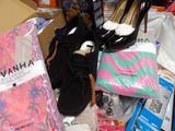 a pile of shoes and other items on the floor