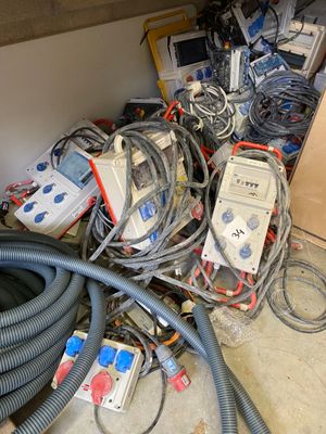 a pile of wires and electrical equipment on the floor