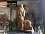 a statue of a man and a dog on a table