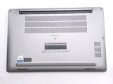 a silver laptop computer sitting on top of a white table