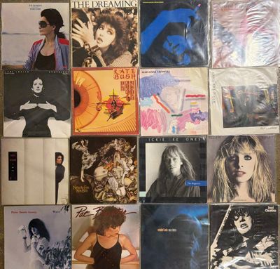 a lot of albums on the wall of the room