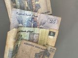 a roll of money sitting on top of a table