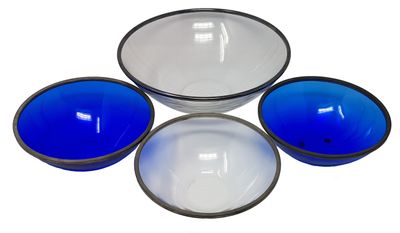 three blue and white bowls sitting next to each other on a white surface