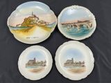 three plates with a picture of a castle on them on a table