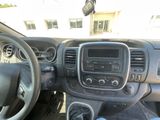 the interior of a car with a steering wheel and dashboard controls