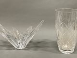 pair of cut glass vases on a gray background