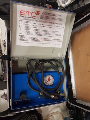 a box with a pressure gauge in it on a table