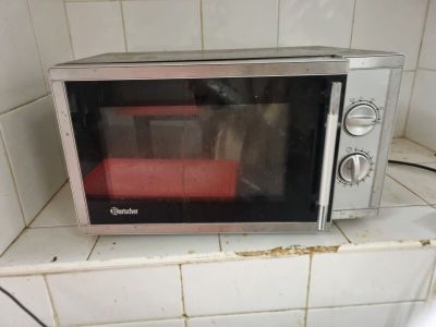 a microwave that is sitting on a counter in a kitchen