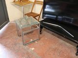 a glass table and a black piano in a room