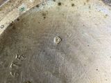 a close up of a metal pan with a metal lid