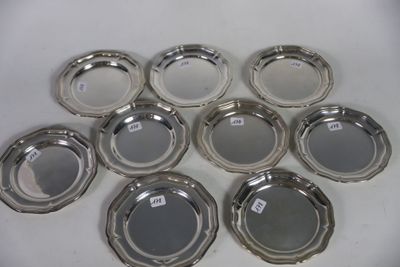six silver plated ashtrays on a white surface