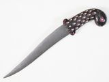 a knife that is laying on a white surface