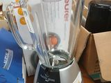 a blender sitting on a table next to a box
