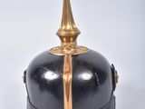 a black and gold helmet on a white surface