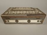 a white and brown box sitting on top of a table