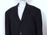 the mannequin is wearing a suit and tie on a mannequin head